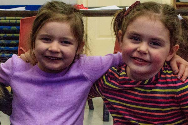 two girls bonding at The Learning Center